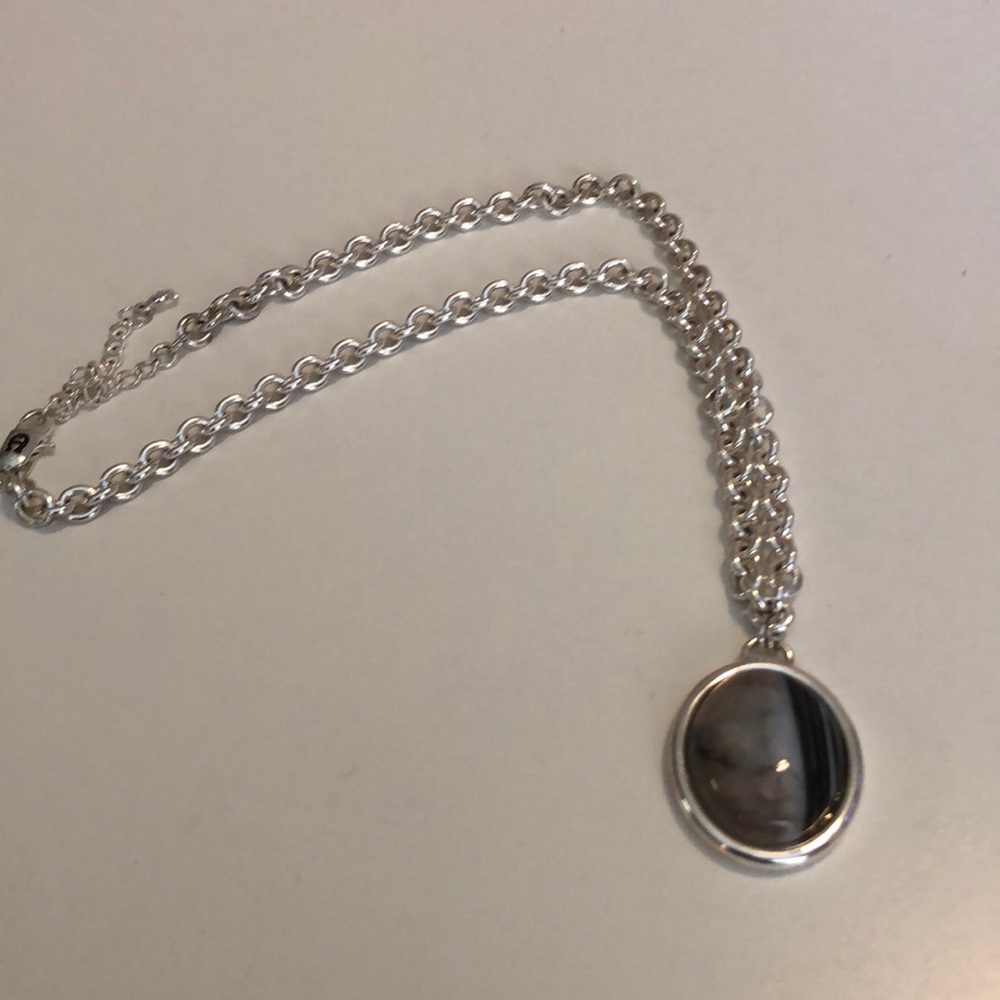 Necklace with stone pendant.
